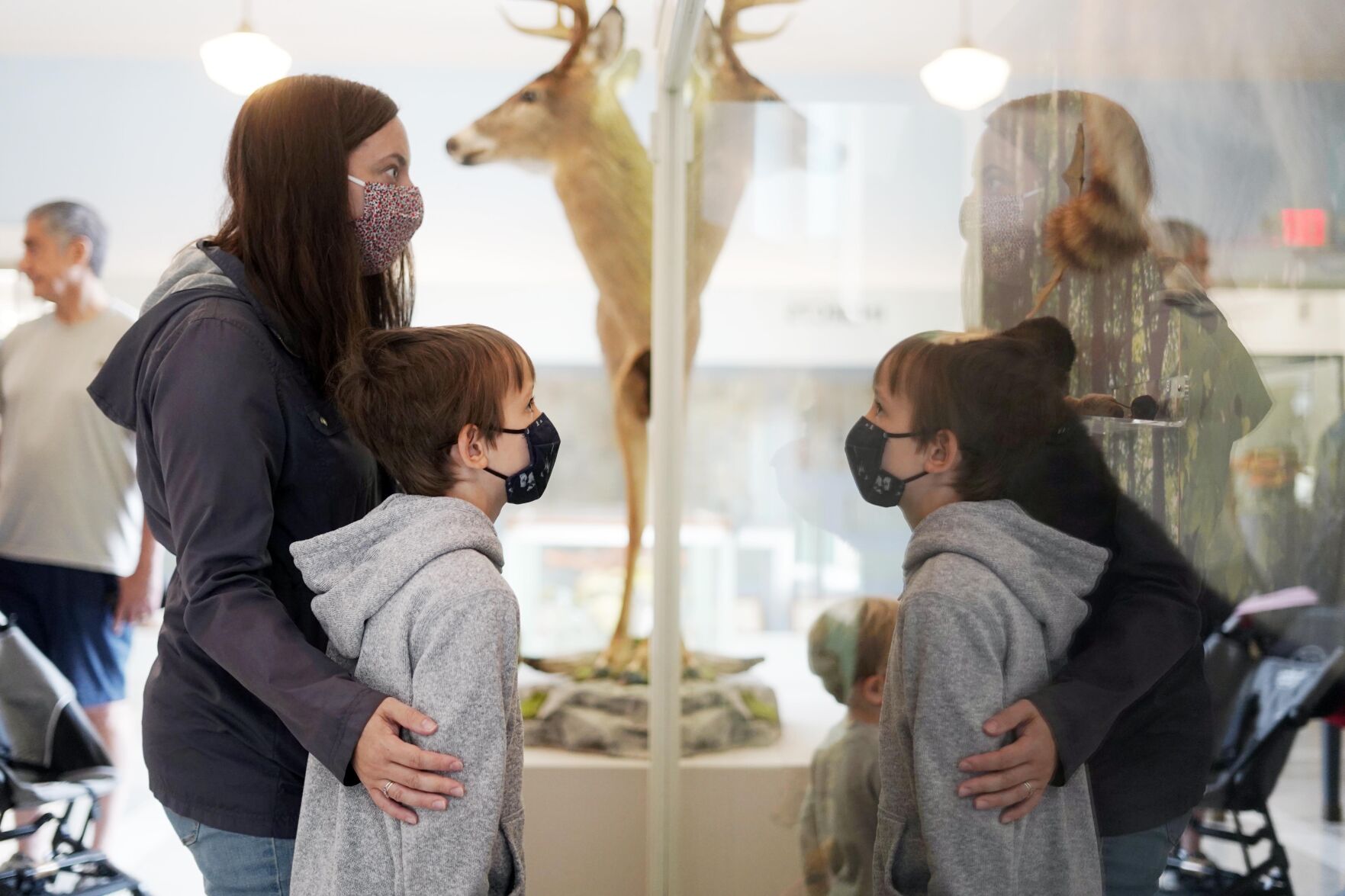 Family looks at sculpture
